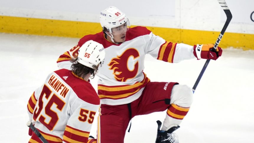 Andrei Kuzmenko scores in his Calgary debut as the Flames beat the listless Bruins 4-1
