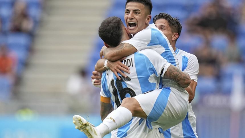 Argentina beats Ukraine 2-0 to reach the quarterfinals of the Olympic men's soccer tournament