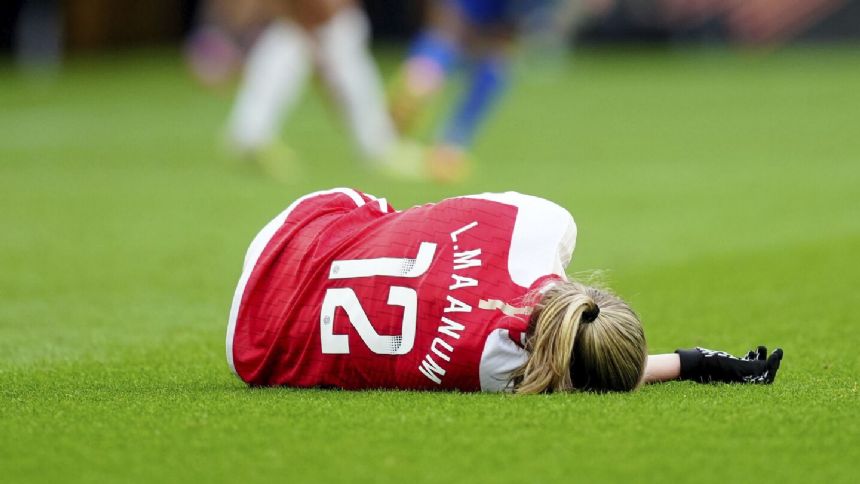 Arsenal Women's Frida Maanum collapses on the field during League Cup final against Chelsea
