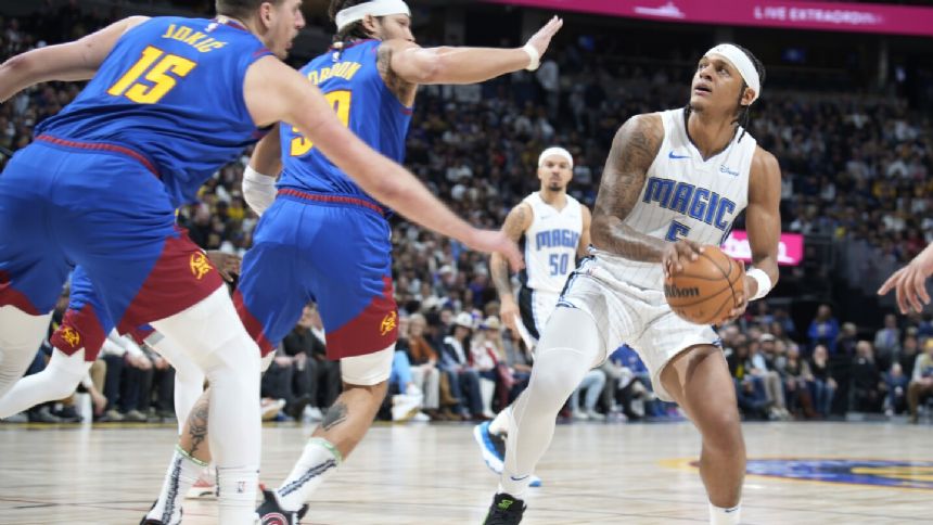 Banchero records 1st triple-double, hits go-ahead free throws as Magic hold off Nuggets 122-120