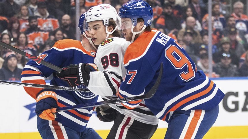 Bedard scores early but McDavid gets 2 assists to lead Oilers past Blackhawks 4-1 for 8th straight