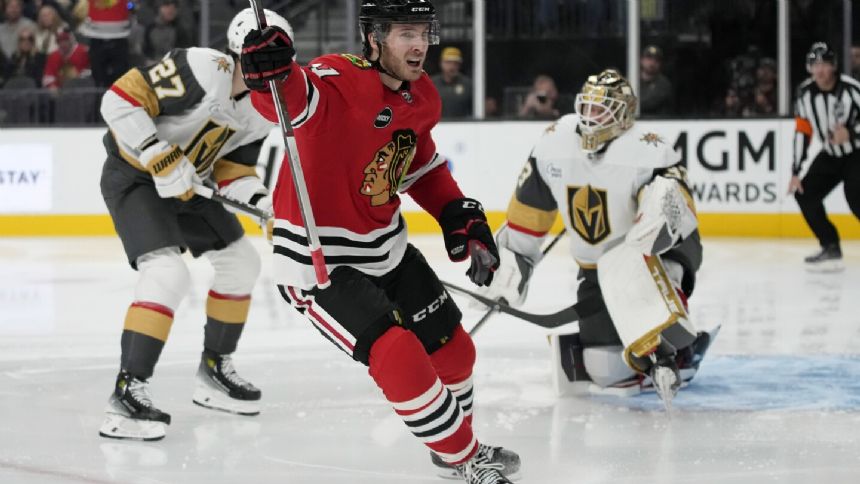 Blackhawks hand Vegas first loss of season with 4-3 win in overtime