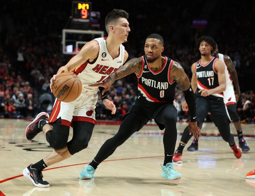 Blazers' Lillard strains calf, leaves in 3rd against Heat