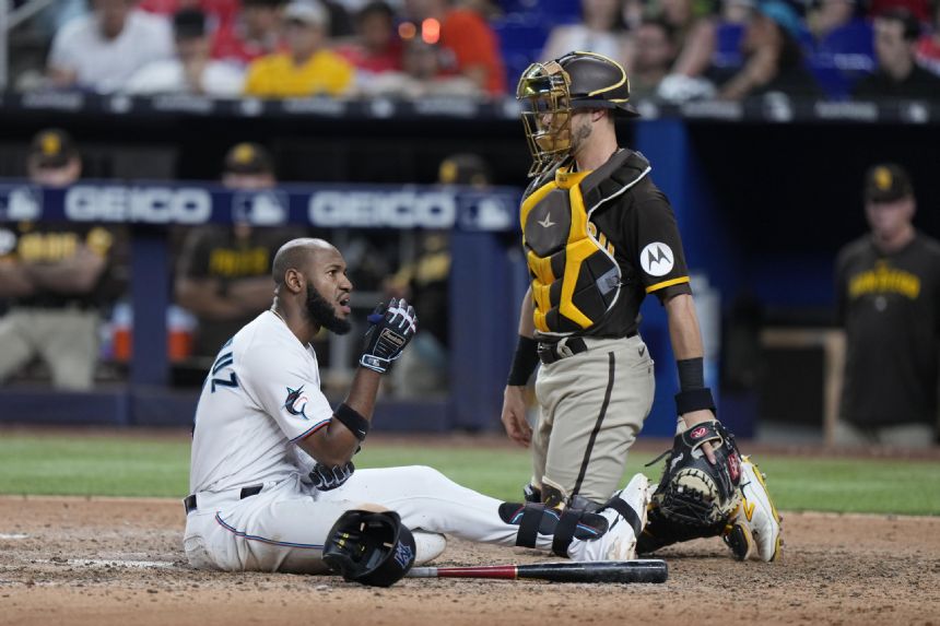 Bogaerts, Carpenter rally Padres over Marlins 9-4 with 5-run 9th