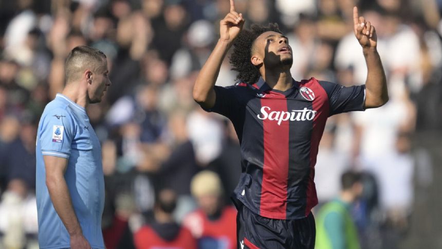 Bologna remains in contention for Champions League place with a 2-1 win at Lazio in Serie A