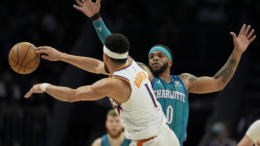 Booker scores 21, Suns use balanced scoring and hold off 4th quarter rally to beat Hornets 107-96