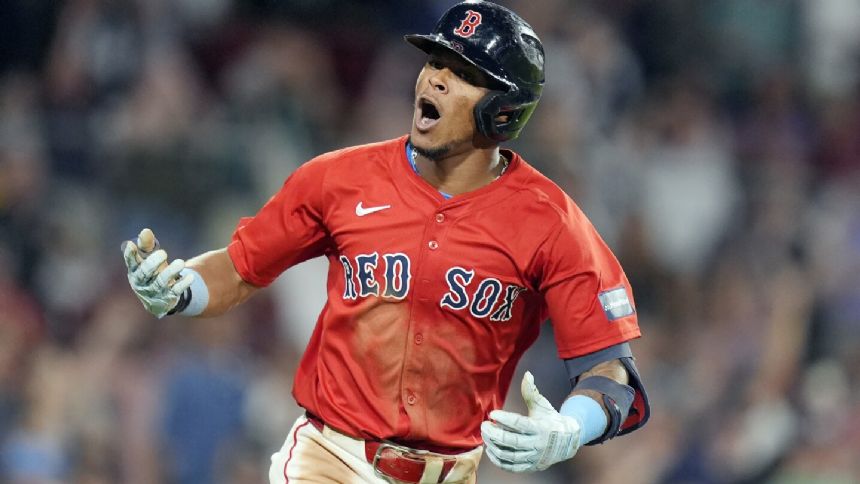 Boston's Ceddanne Rafaela tagged out for double play while talking to third base coach Kyle Hudson