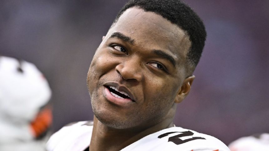 Browns receiver Amari Cooper restructures final year of contract, reports to camp, AP source says