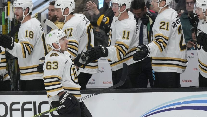 Bruins beat the winless Sharks 3-1 for their 3rd straight win to open the season