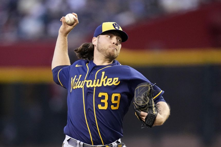 Burnes outduels Kelly, Brewers top Diamondbacks 7-1