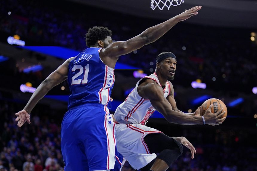 Butler's acrobatic layup, 23 points lead Heat past 76ers