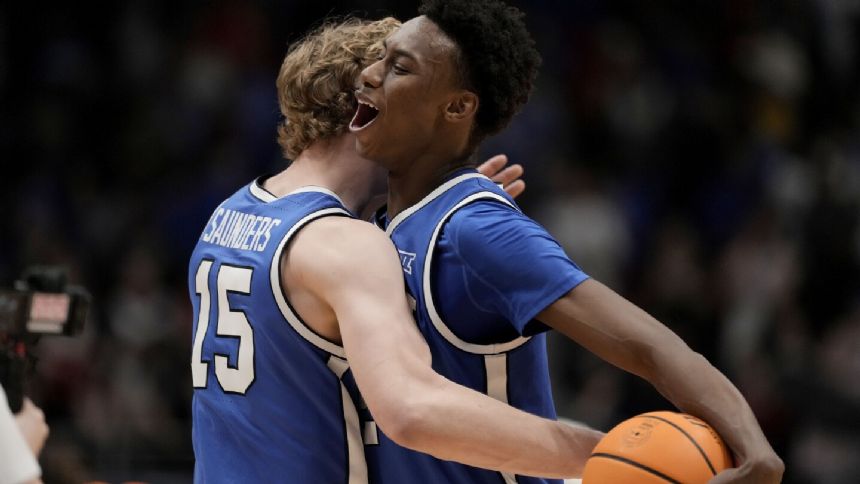 BYU halts 19-game home win streak for No. 7 Kansas with 76-68 victory at Allen Fieldhouse