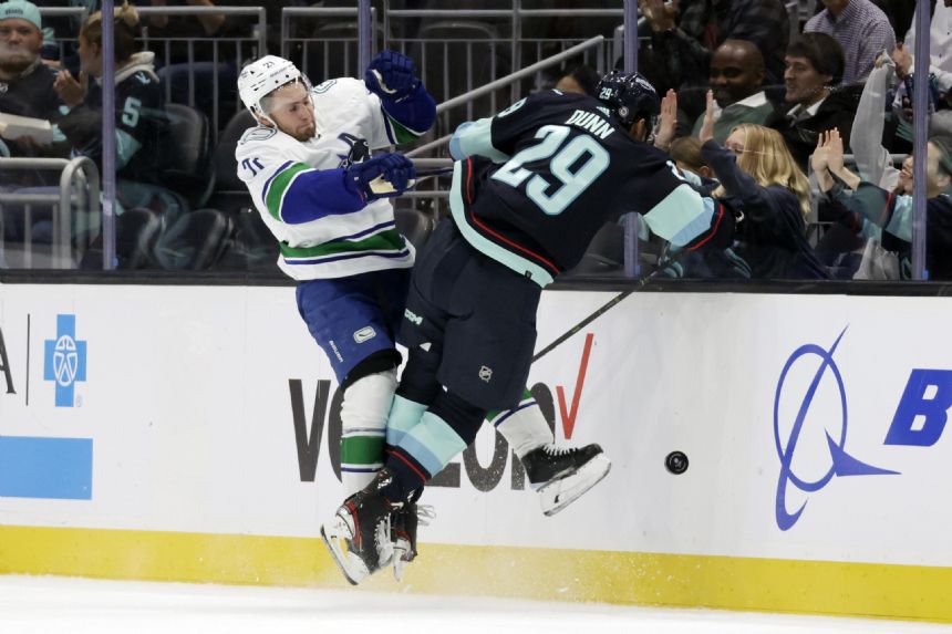 Canucks end season-opening skid at 7, beating Kraken 5-4