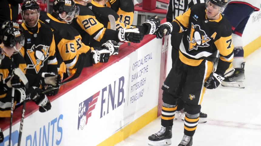 Carter and Smith score late as Penguins pull away from Blue Jackets 5-3 to end 3-game skid