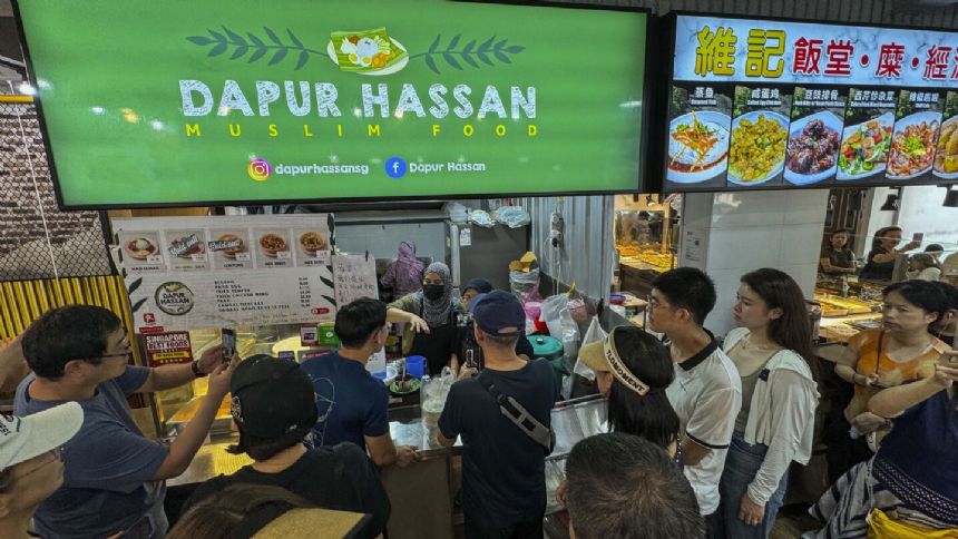 Chinese soccer fans are pouring money into a food stall run by Singapore's goalkeeper. Here's why
