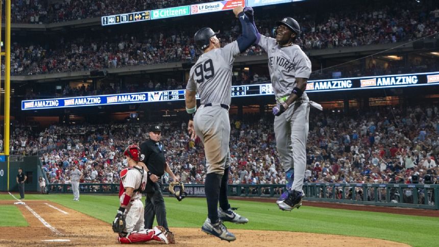 Chisholm's second straight 2-homer game helps Yanks top Phils 7-6 in 12 innings for 4th straight win