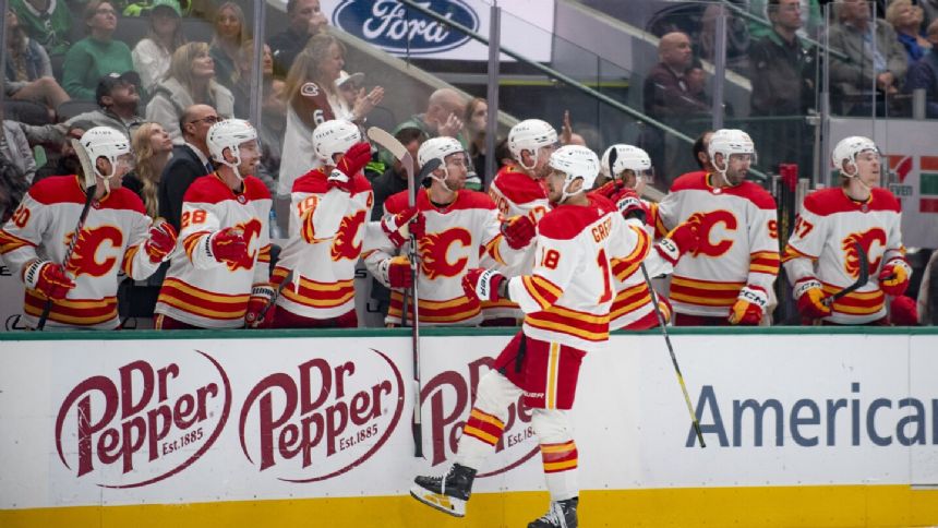 Coleman and Lindholm ignite 4-goal 3rd period for Flames in 7-4 win over Stars