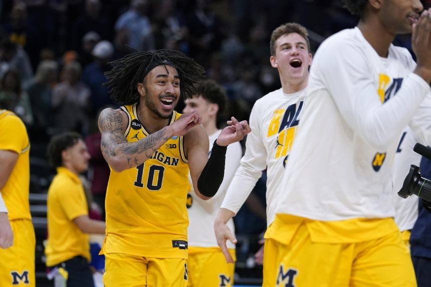 Collins provides spark, Michigan beats Colorado State 75-63