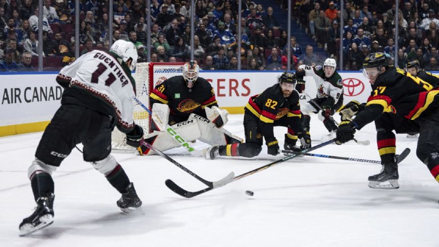 Cooley scores in OT to lift Coyotes to 4-3 win over first-place Canucks