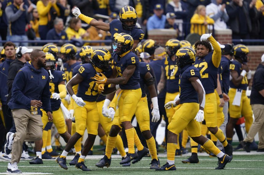 Corum's 243 yards, 2 TDs lead No. 4 Michigan past Maryland