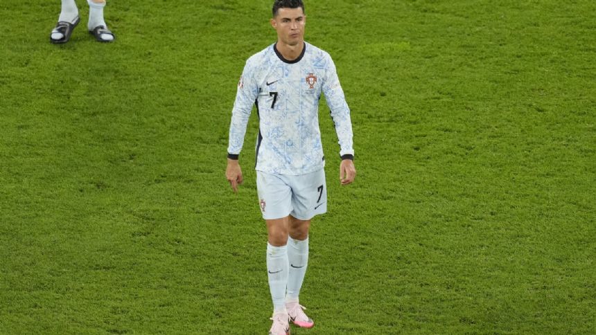 Cristiano Ronaldo just avoided being hit by a fan who jumped from the crowd to get to him at Euros