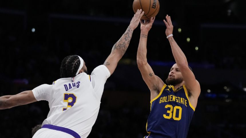 Curry scores 31 as Warriors defeat Lakers 128-121