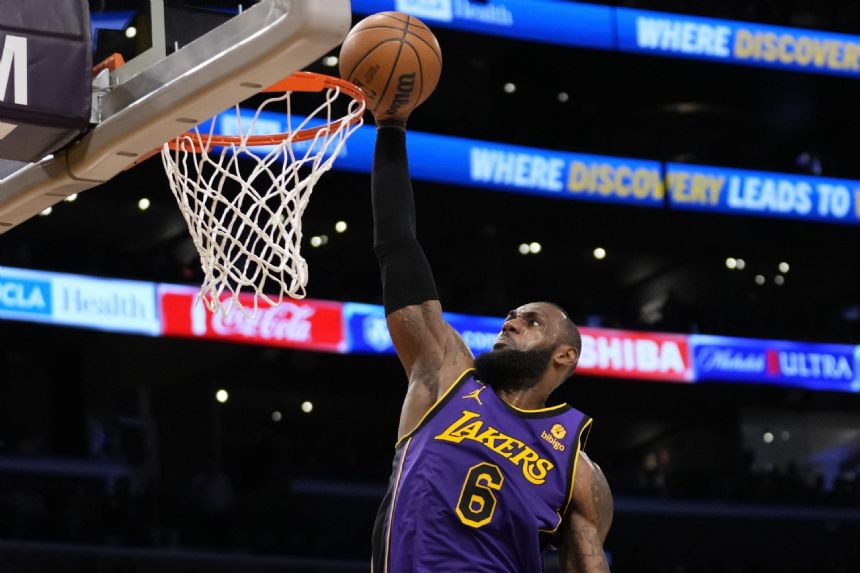 Davis injured, but LeBron leads Lakers past Denver 126-108