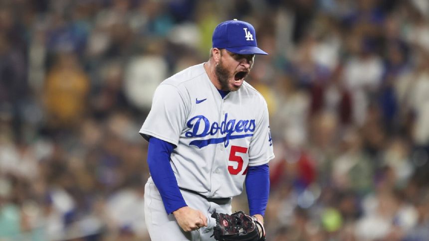 Dodgers wrap up NL West title for 10th time in 11 years with 6-2 win over Mariners in 11 innings