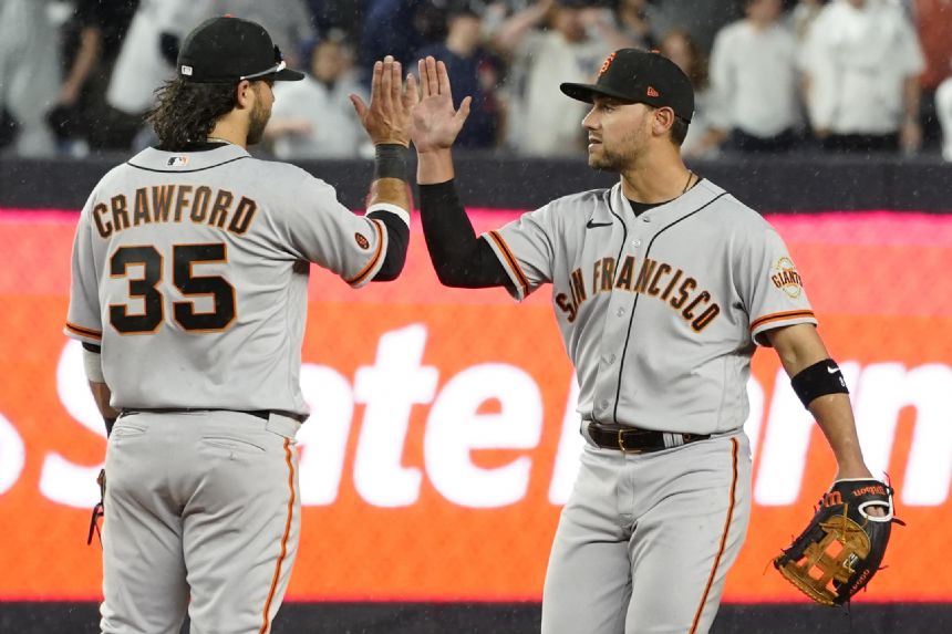 Doval escapes in the 9th as Giants hold off Yanks 7-5