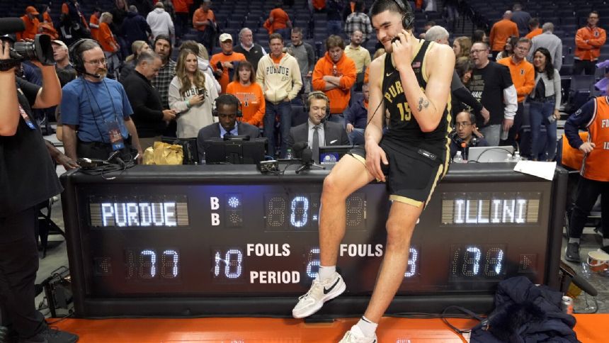 Edey helps rally No. 3 Purdue to 77-71 win at No. 12 Illinois to clinch outright Big Ten title