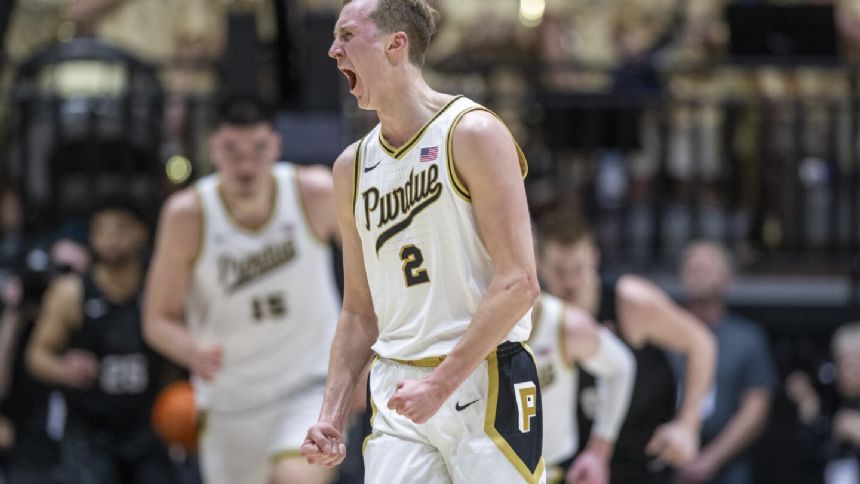 Edey leads No. 2 Purdue past Michigan State 80-74 to clinch share of 2nd straight Big Ten title