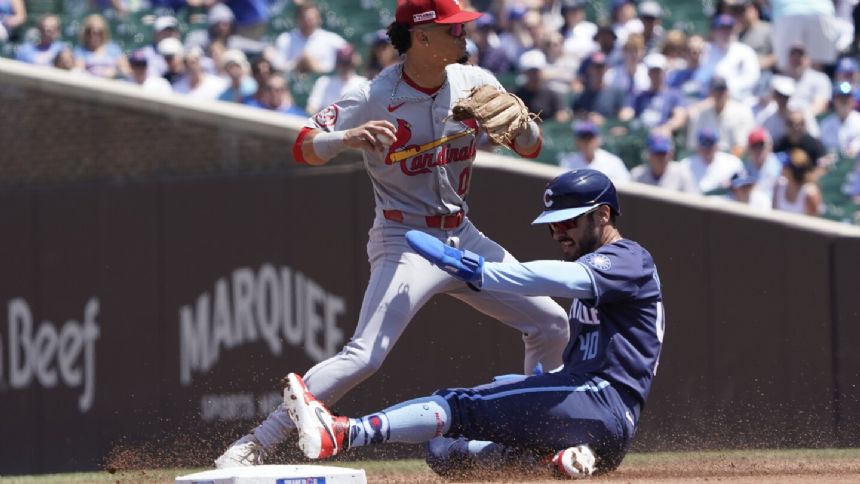 Gibson dominates, Pages homers as Cardinals beat Cubs 3-0