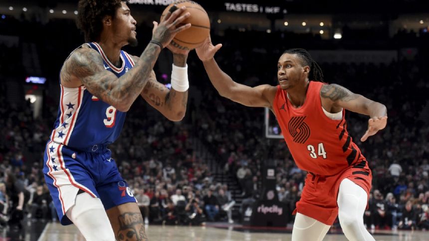 Grant has 27 and Blazers beat the 76ers 130-104 as Embiid nurses sore left knee