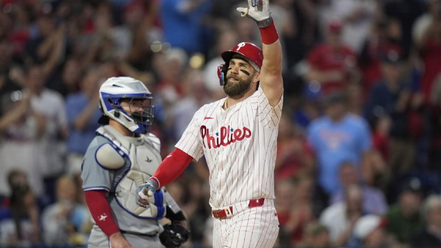 Harper hits grand slam, streaking Phillies rout Blue Jays 10-1