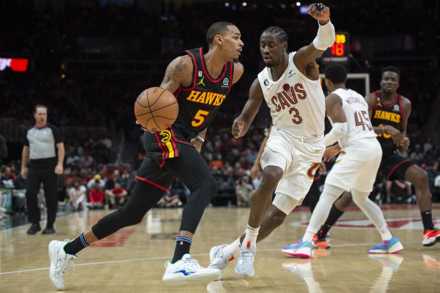 Hawks beat Cavaliers 120-118, help Bucks clinch Central