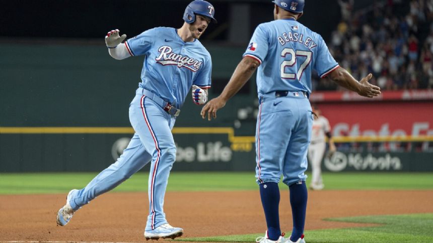 Heim homers, Heaney solid as Rangers beat Orioles 3-2 to avoid sweep