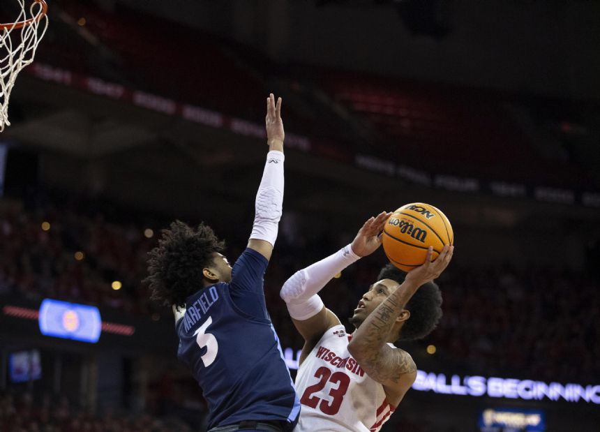 Hepburn and Wisconsin knock off Liberty 75-71 in NIT