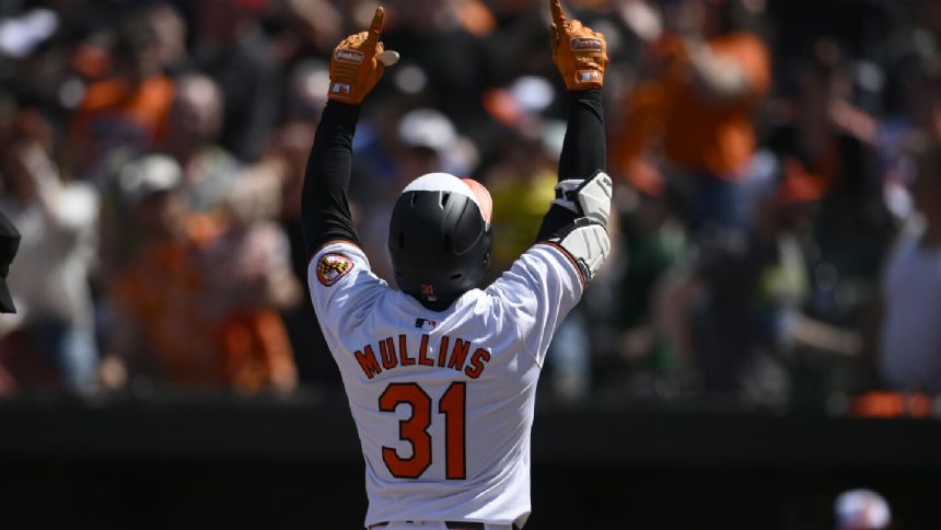 Holliday's first hit helps the Orioles rally to a 6-4 win over the ...