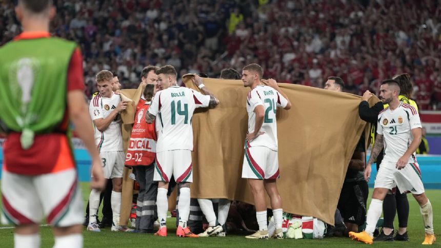 Hungary forward Barnabas Varga stretchered off after serious-looking injury against Scotland