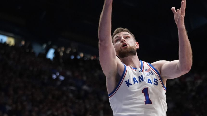 Hunter Dickinson scores 20 to lead Kansas past Texas 86-67