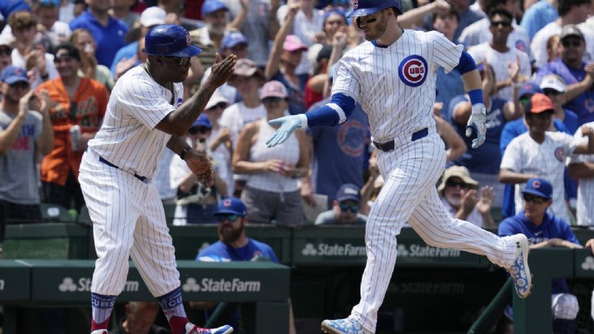 Ian Happ and Dansby Swanson hit back-to-back homers as the Cubs hold off the Giants 6-5