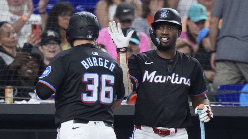 Jake Burger homers and doubles in the Marlins' 6-4 victory over the Mets