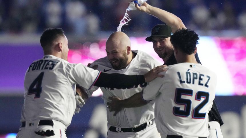 Jake Burger's walk-off single completes 5-run rally in ninth, Marlins ...