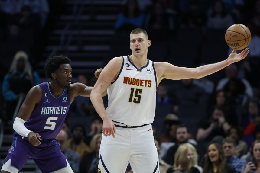 Jokic carries short-handed Nuggets past Hornets 119-105