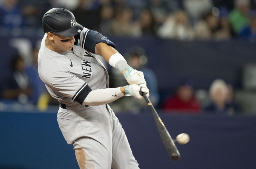 Judge HRs twice, including 462-foot drive, Boone ejected as Yanks beat Blue Jays 7-4