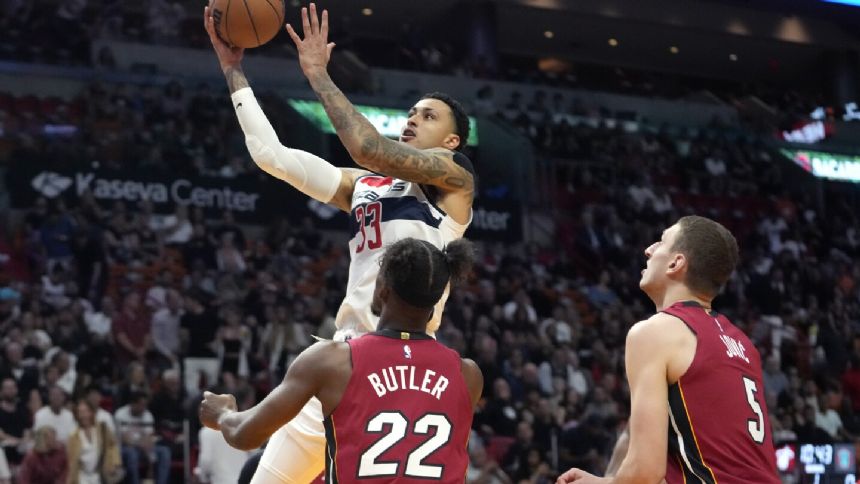 Kuzma scores 32 points as Wizards hold on to top Heat 110-108