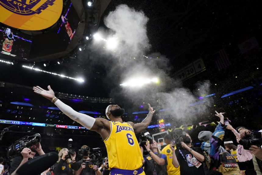 LeBron James chases NBA history on a star-filled night in LA