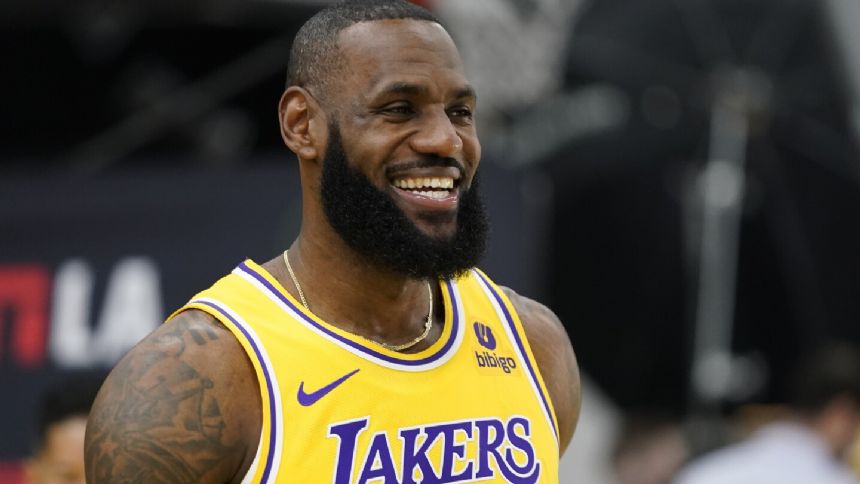 LeBron James returns for 21st NBA season with relief for Bronny