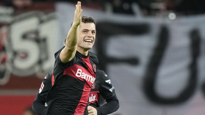 Leverkusen extends Bundesliga lead to 11 points and sets German 33-game unbeaten record