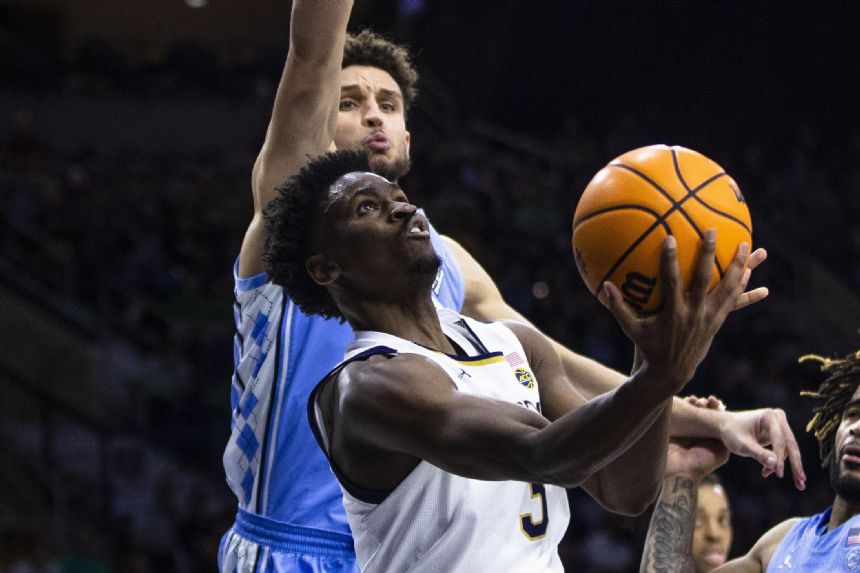 Love, Bacot lead North Carolina past Notre Dame 63-59